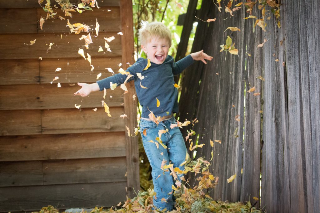 Happy Boy Playing in Leaves from Alison Escalante MD