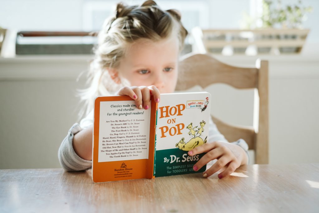 Reading child. Alison Escalante MD