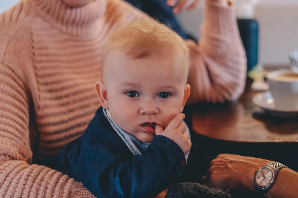 Toddler on his mother's lap