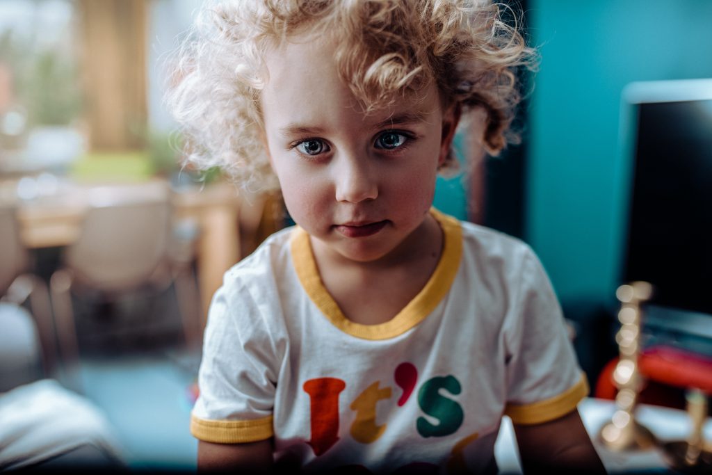 Young child in room of toys